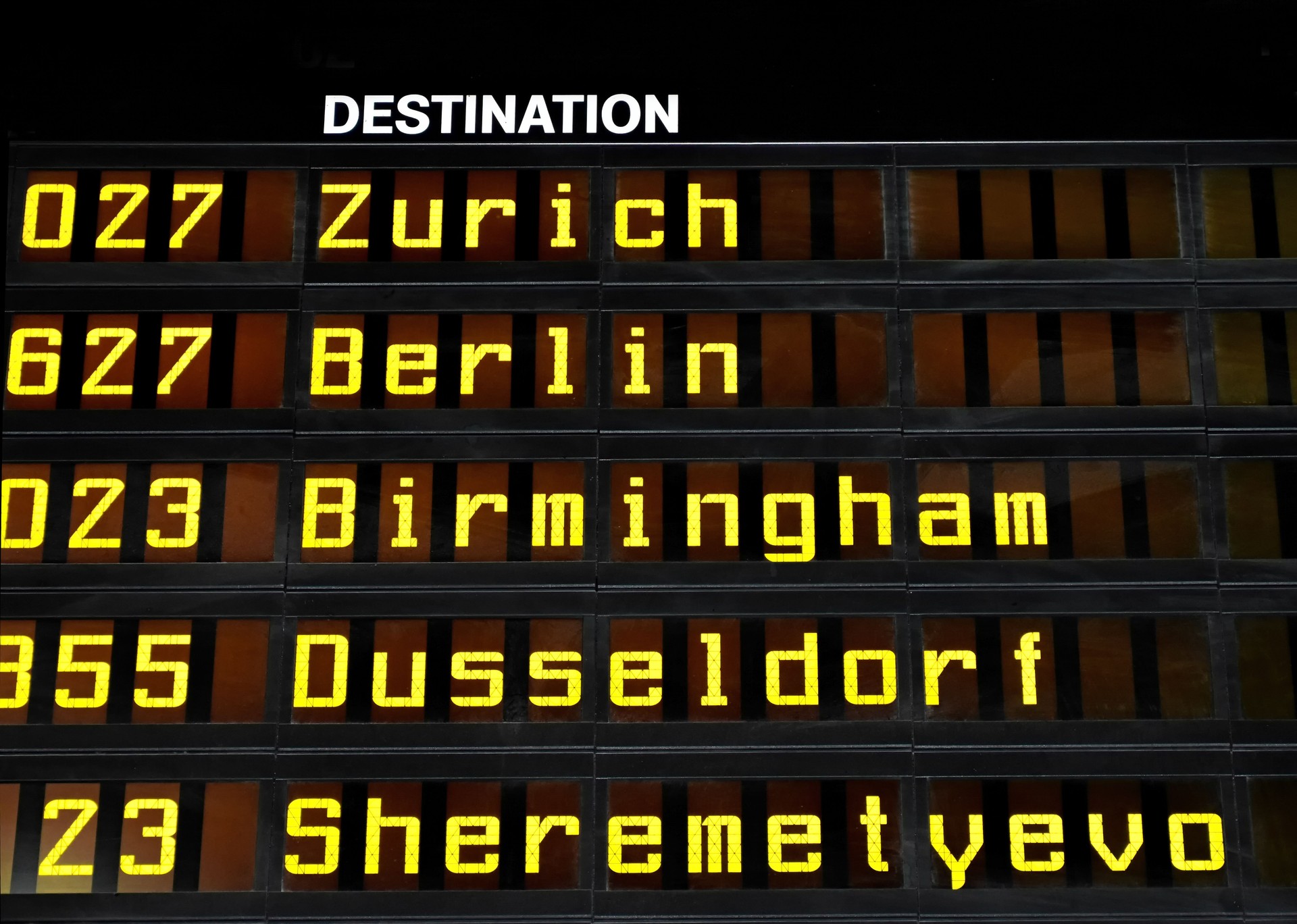 Airport departures board with the destinations Zurich, Berlin, Birmingham, Dusseldorf and Moscow Scheremetjevo